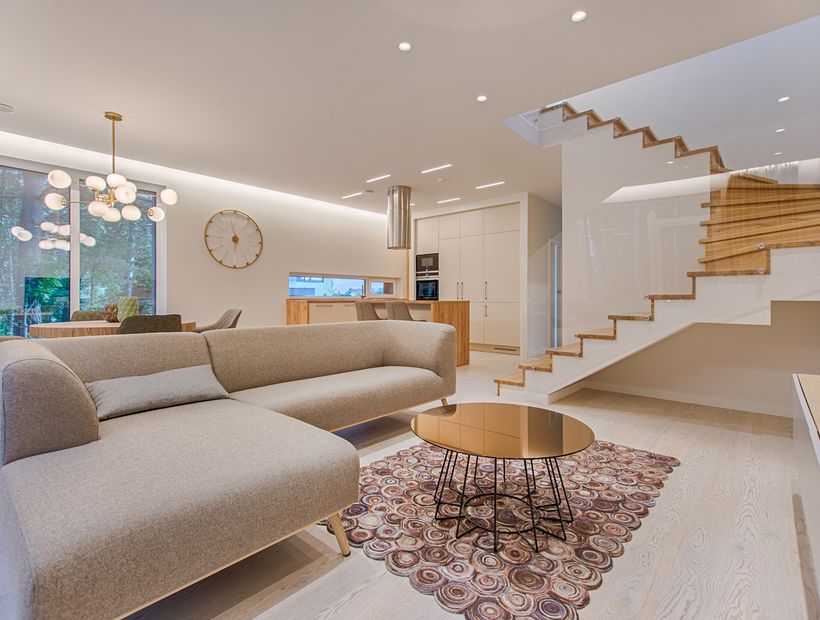 Bright, freshly cleaned living room with sofa and natural light
